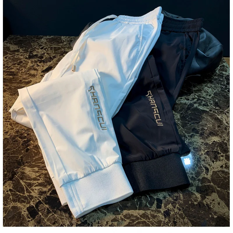 

Summer thin ice silk casual pants for men, 2025 new fashionable breathable drawstring leg tied sports pants