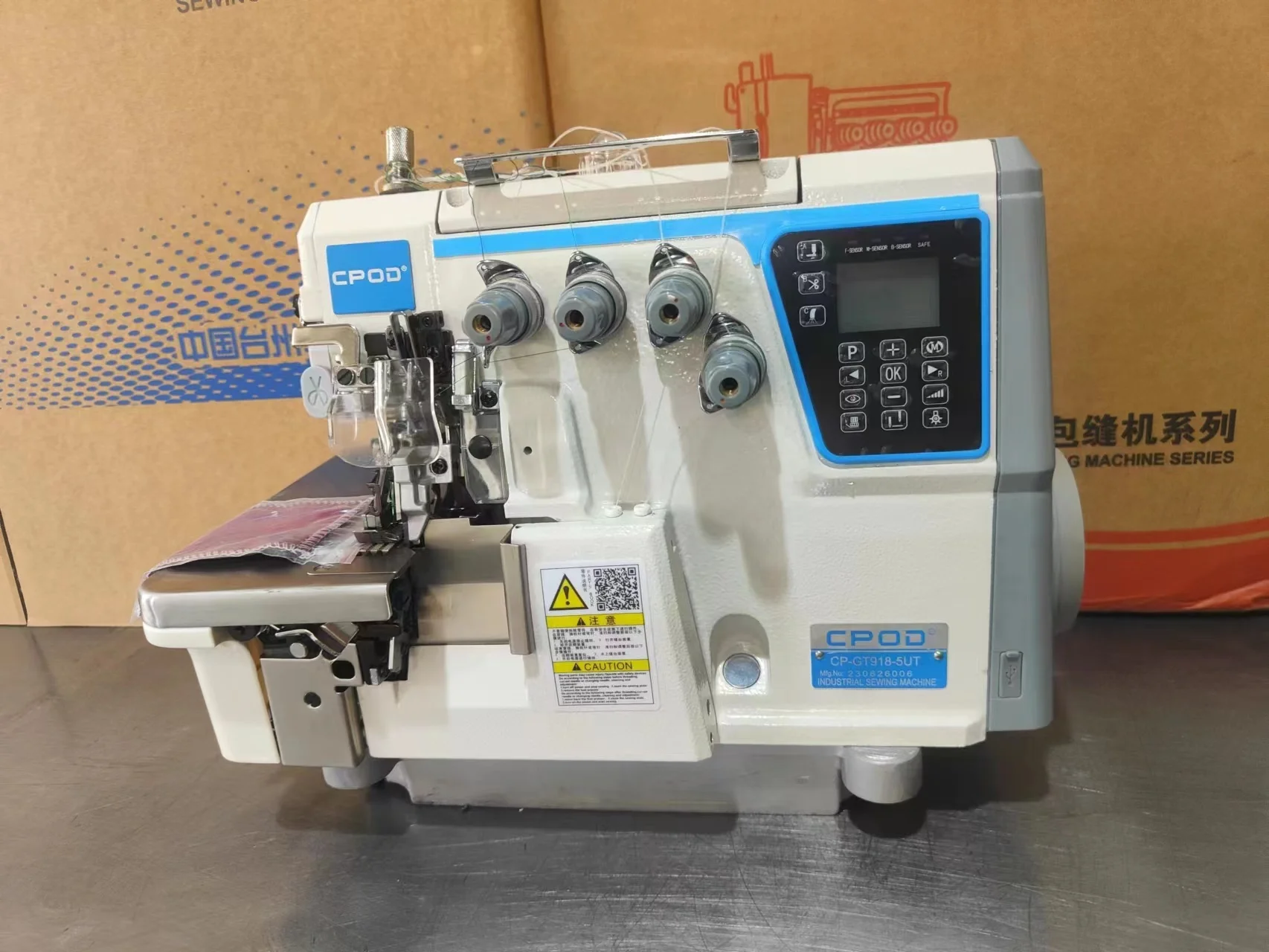 QK-747 Stepping motor four thread automatic industrial overlock sewing machine with automatic trimmer