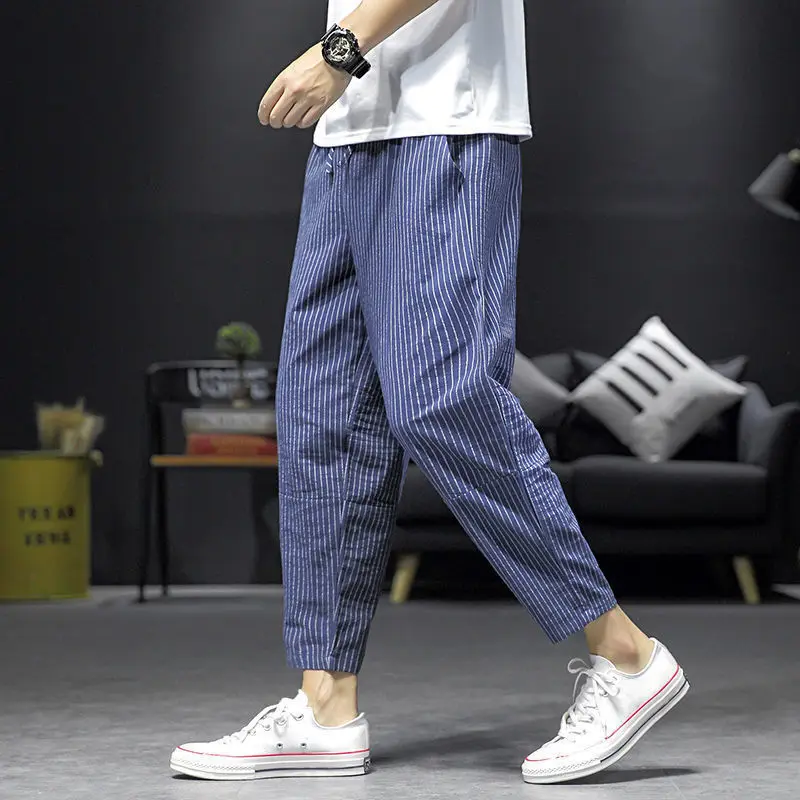 Pantalones holgados de cintura elástica para hombre, pantalones cómodos informales a la moda, con bolsillos, a rayas, simplicidad, primavera y verano, 2023