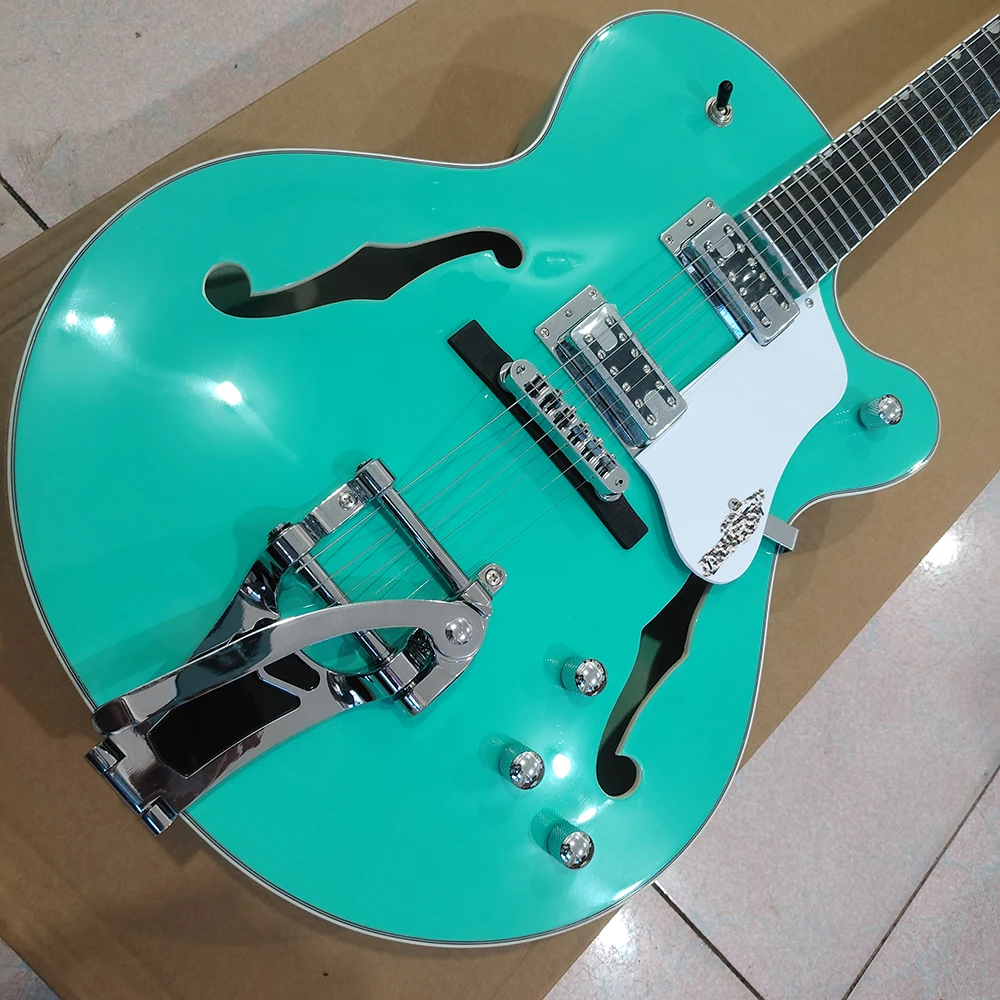 High quality mint green electric guitar, dual f-holes, large vibrato system, in stock and fast shipping