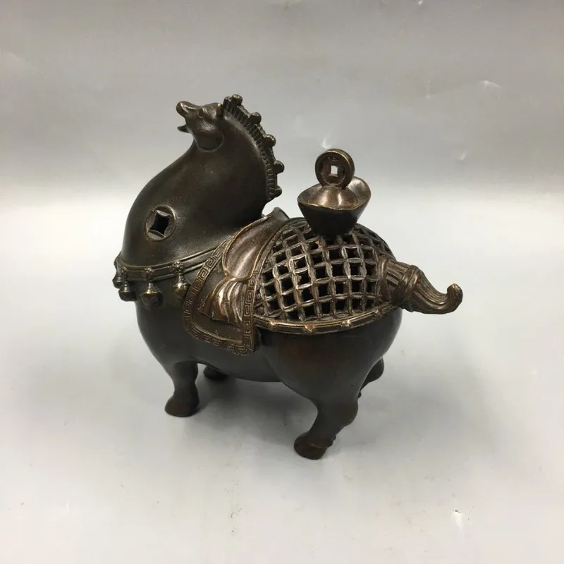 Antique brass incense burner with a vintage, aged finish, featuring a horse design and a lid, a decorative piece for display