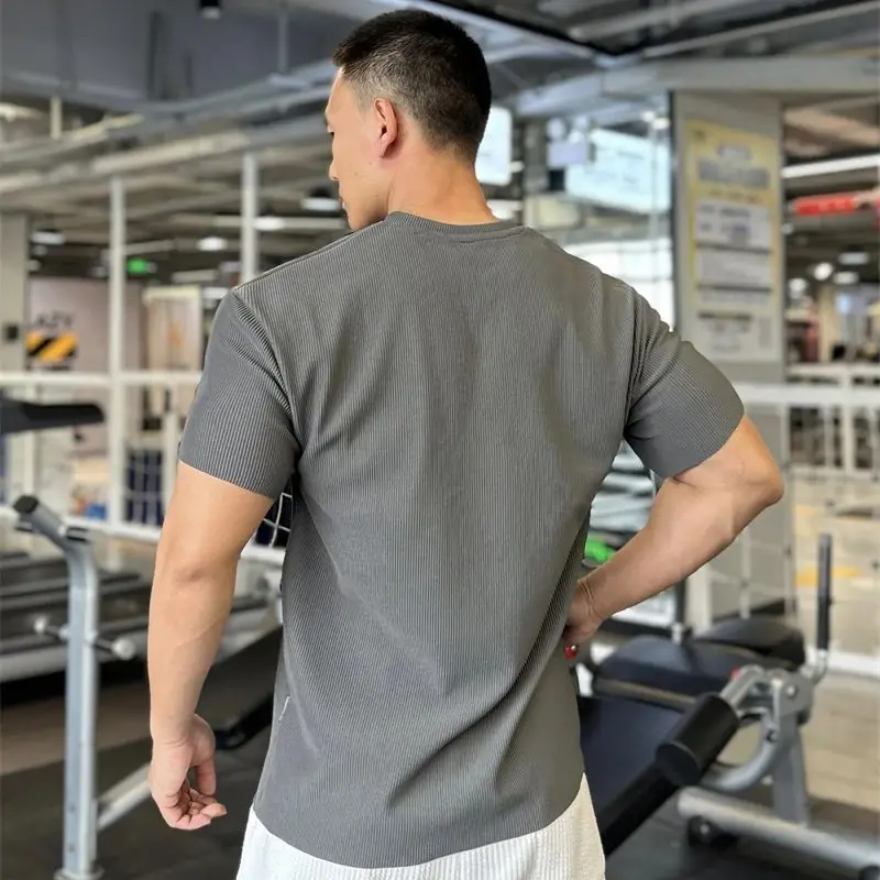 Gym loose men's sportswear V-neck short-sleeved T-shirt top vertical grain solid color casual men's wear