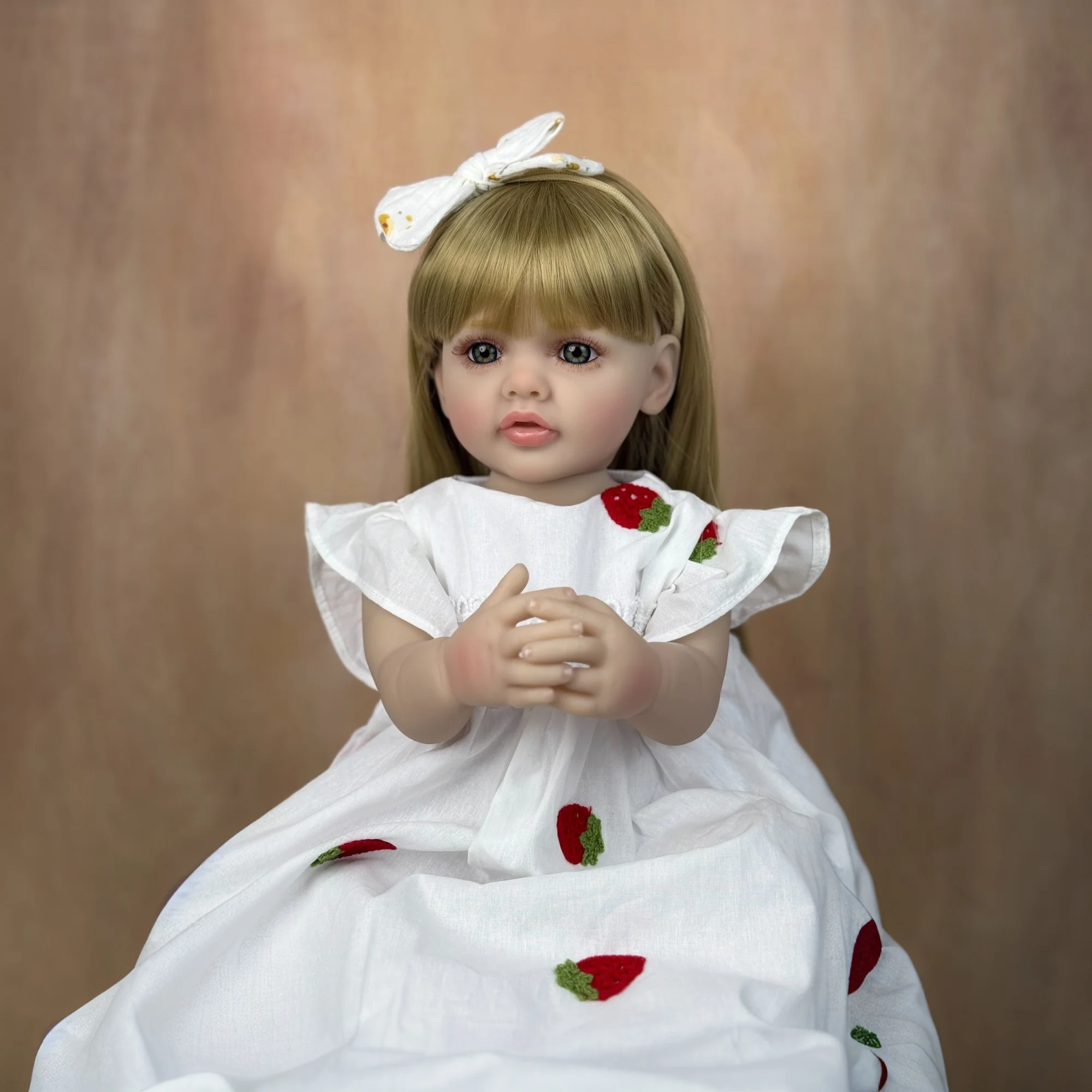 22 Inch Lifelike Reborn Girl Doll Long Dark Brown Hair Full Vinyl Body Pink Knitted Floral Skirt With Big Bow Flower Hair Clips Can Bathe Kids Role Play Toy Birthday Christmas Gift