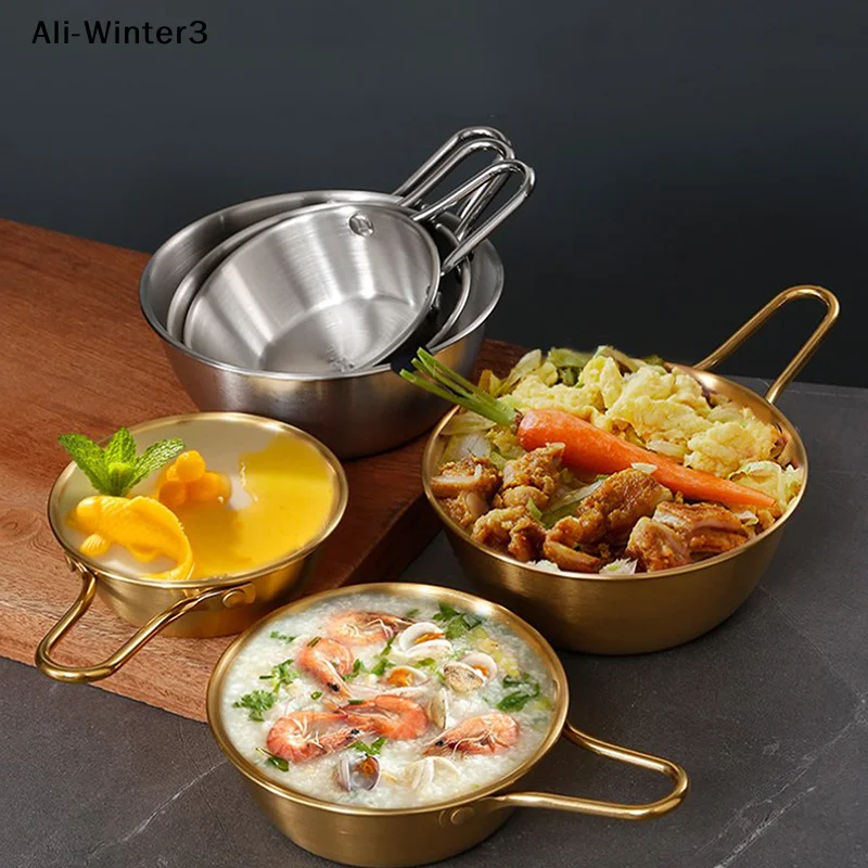 Bowl filled with sauce, showing handle