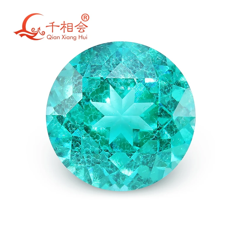 

Paraiba with a neon glow round shape lab grown Yttrium Aluminum Garnet with inclusions Neon-like gem stone jewelry YAG