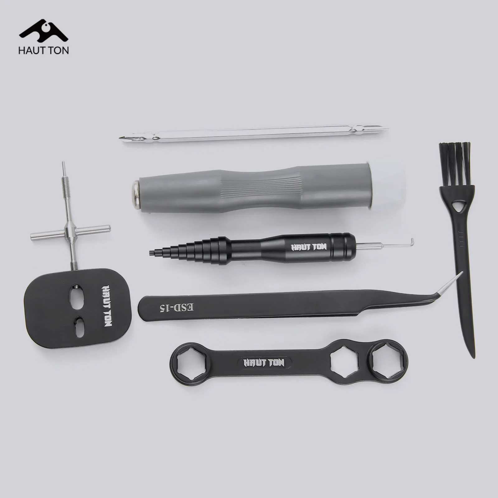 El kit de reparación y mantenimiento de desmontaje de carrete de pesca HAUT TON contiene llave multifunción, destornillador, pinzas, cepillo, etc.