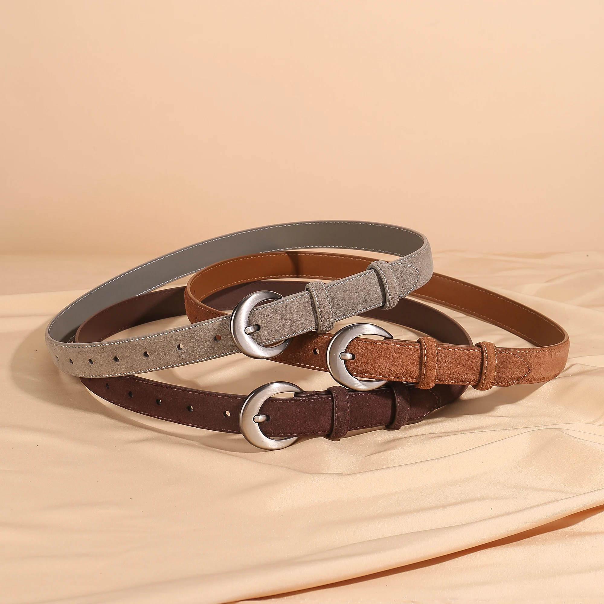 Stylish women's suede leather belt crafted from double-layer cowhide with a designer silver buckle. Available in multiple colors