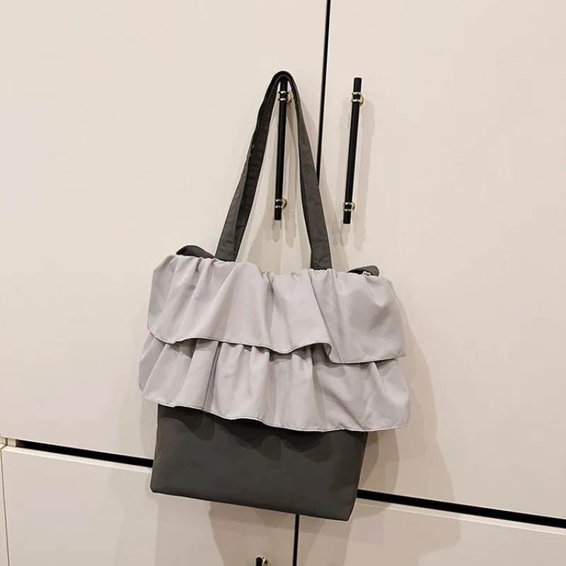 ユニークなレジャー用おむつバッグ-ヴィンテージ風のおしゃれな単色通勤バッグ-トレンドデザインのレターロゴクロスボディバッグ