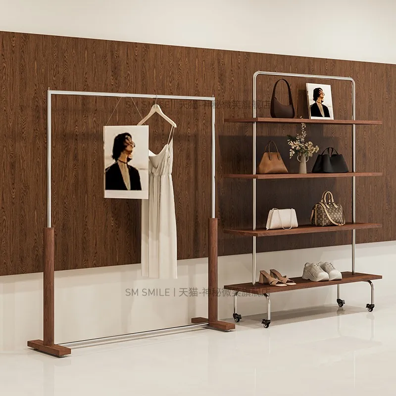 

Clothing store display rack Floor-to-ceiling black multi-layer middle island rack Stainless steel shoe bag rack Women's clothing