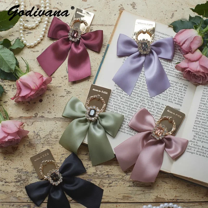 Nastro Macaron lucido giapponese Bowknot supporto per cellulare anello allacciato filo metallico intagliato anello con strass Maison