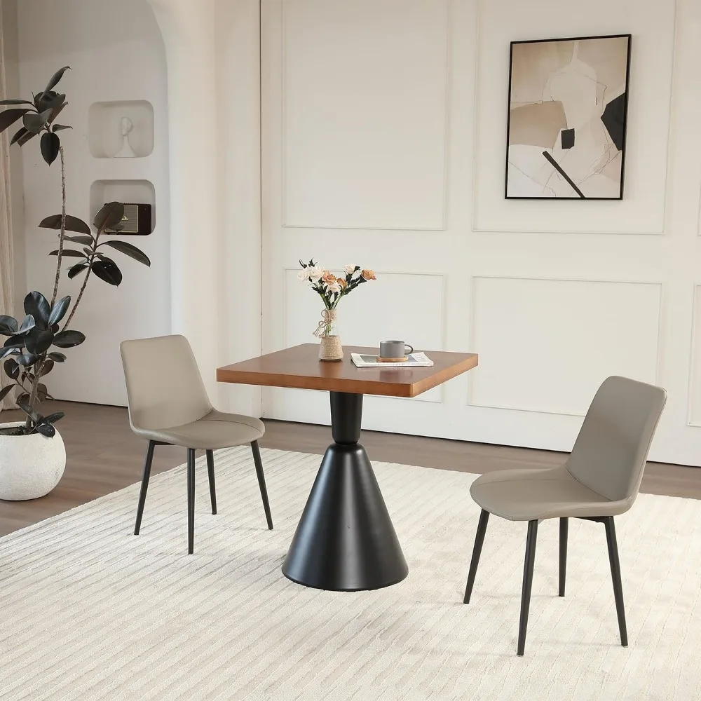 paar moderne kunstleren eetkamerstoelen uit het midden van de eeuw voor comfortabele keukenzitplaatsen