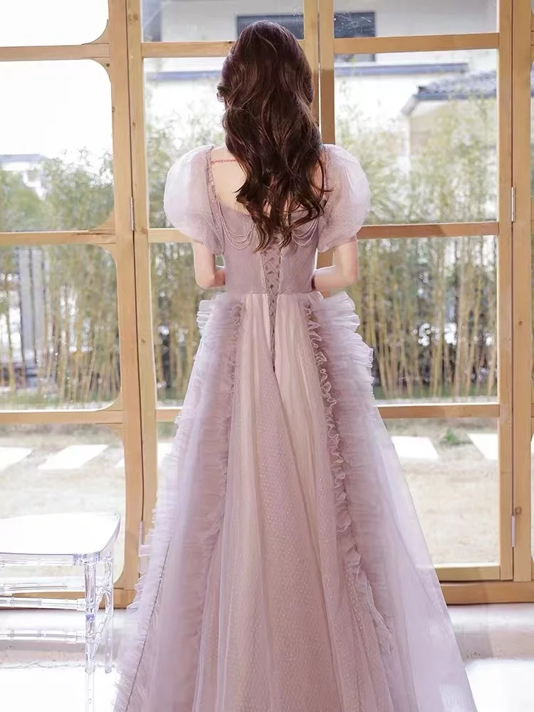 Splendido abito da sera viola rosa Elegante abito da festa formale da donna lungo con perline e maniche a sbuffo in tulle sexy senza schienale con lacci