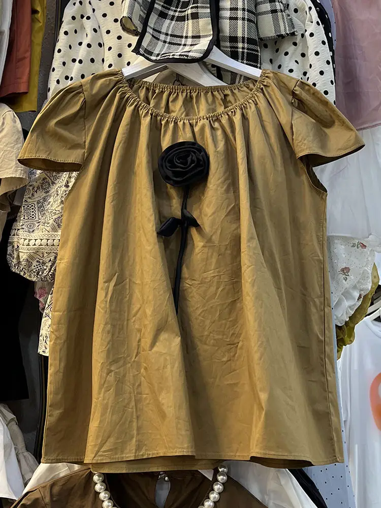 フレンチスイート年齢軽減デザインニッチ立体フラワーパフスリーブシャツ女性の新しい夏のトップ