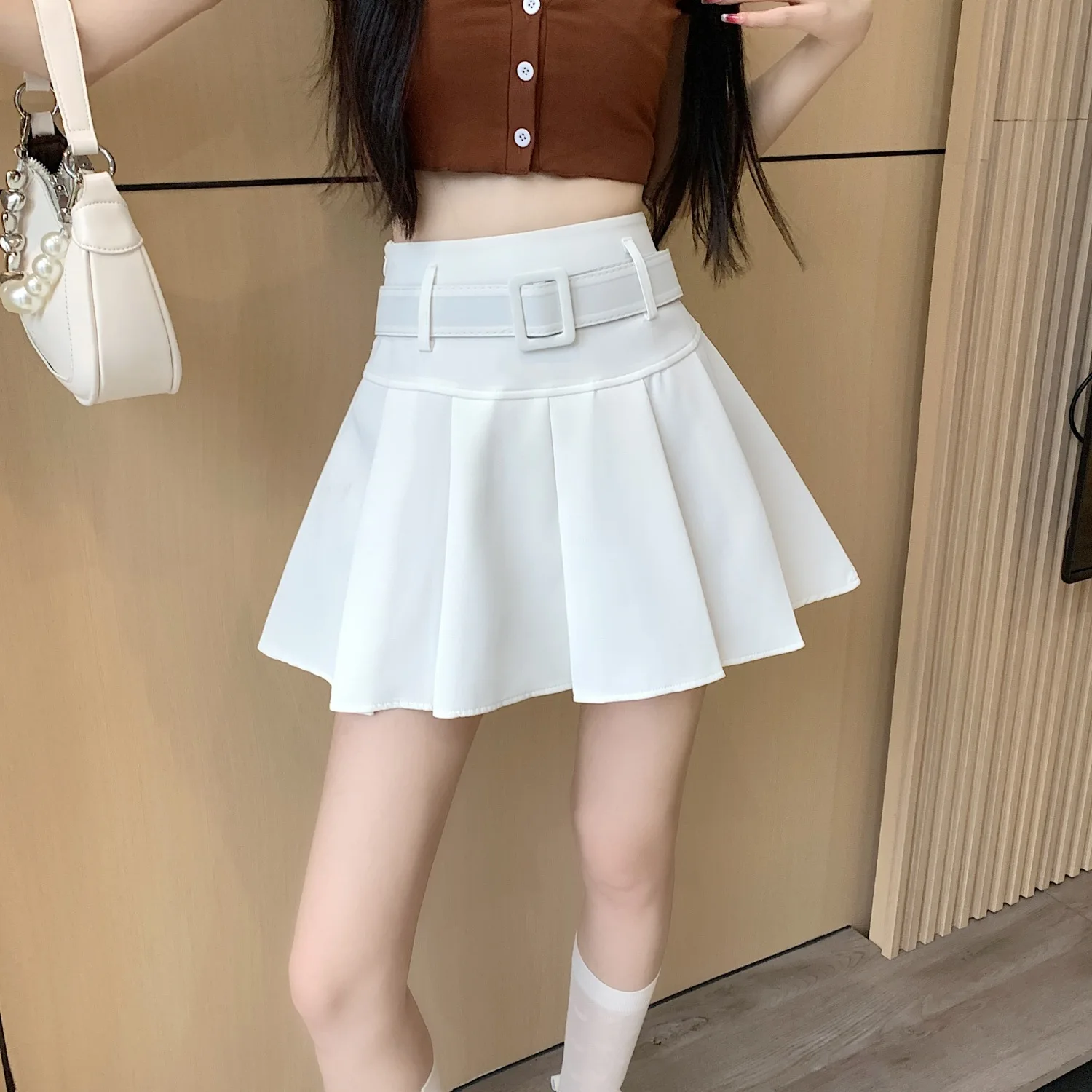 Wedbleser media falda rosa plisada verano 2025 nueva cintura alta adelgazante A-line dulce picante estilo universitario faldas cortas que abrazan la cadera