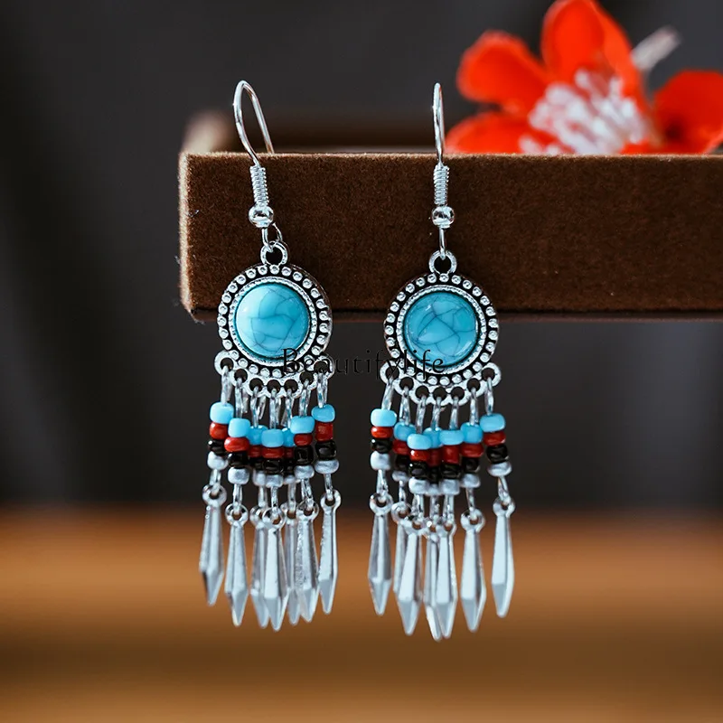 

Multi-layer rice bead bohemian earrings, small iron bells, turquoise earrings.