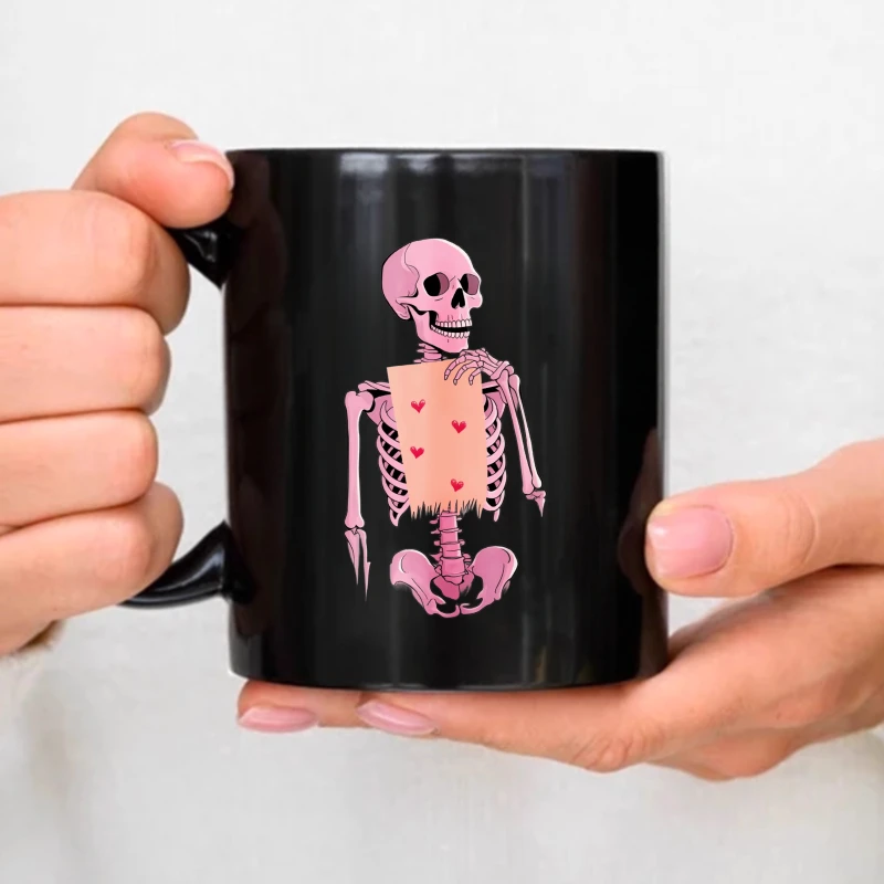 Black ceramic cup with a pink skull holding heart pattern, suitable for Halloween and Valentine's Day