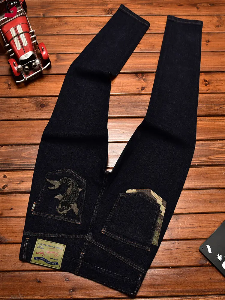 High end trendy Chinese style embroidered printed jeans men's fashion design slim fit small feet elastic denim pants