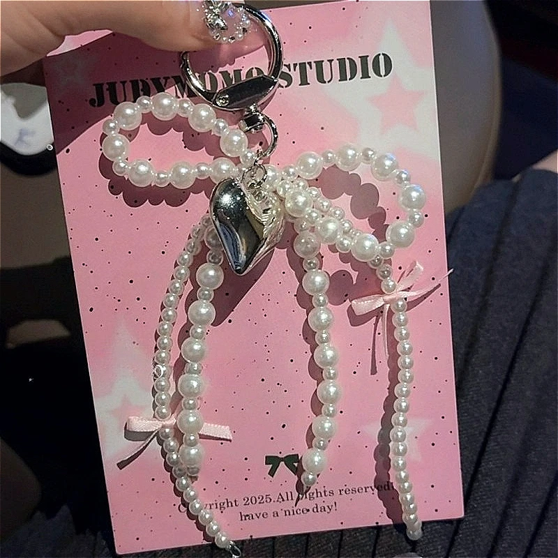 Y2K INS اللؤلؤ Bowknot المفاتيح النساء اللؤلؤ شرابات الوردي الشريط الحلو معلقة Keyrings ظهره حلقة رئيسية اليدوية مجوهرات هدايا