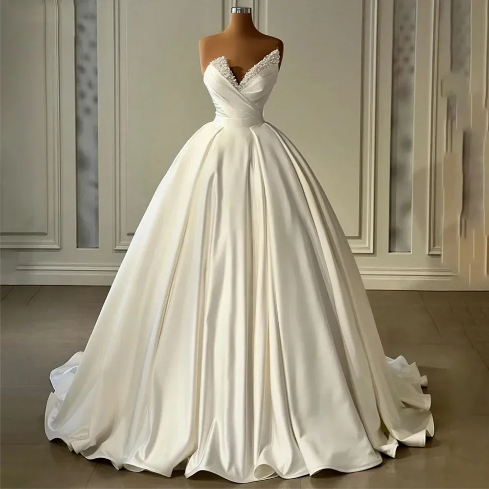 Seksowna suknia ślubna z dekoltem w szpic, wspaniała satynowa, romantyczna bez ramiączek, puszysta suknia ślubna z w stylu księżniczki w kolorze kości słoniowej