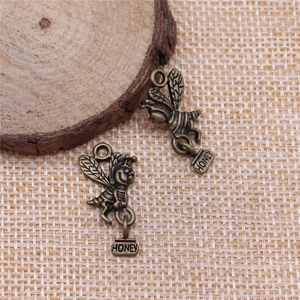 

20pcs 19x12mm(0.75x0.47inch) 2 Colors Antique Bronze Color Antique Silver Color Bee Carrying Honey Charms Pendants