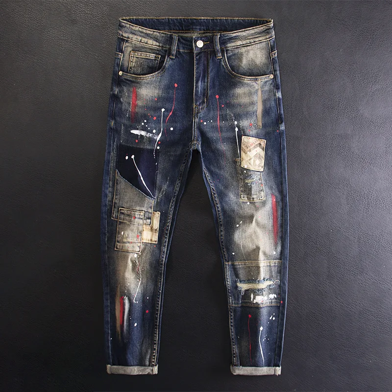 

High end denim pants for men with paint splatter, holes, patches, patchwork, fashionable trend, elastic and slim fit pants