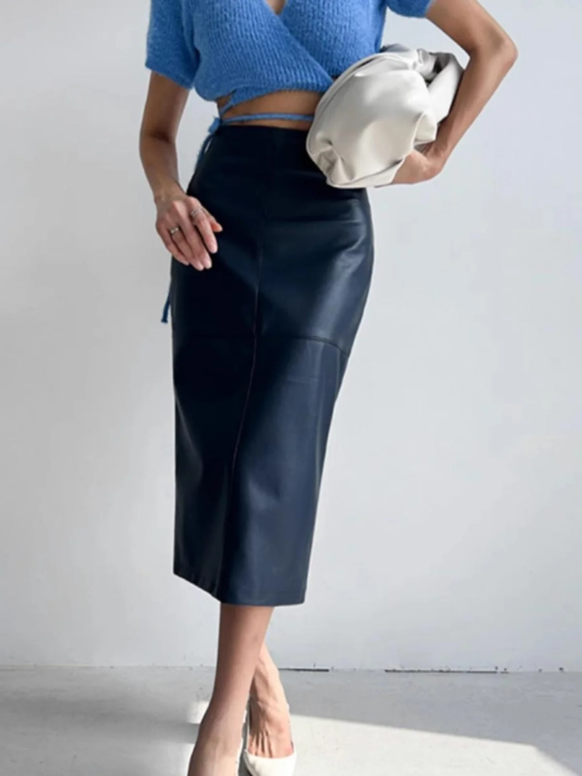 تنورة نسائية عالية الخصر من الجلد بمفصلة الورك بلون نقي كاجوال متوسطة الطول ملفوفة حول مجموعة ربيع الشارع Sle #1