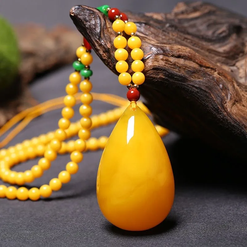 Baltic Sea bewaxed chicken Oil Yellow Drop Pendant Stone Amber pendant men's and women's sweater Chain Chicken oil amber necklac