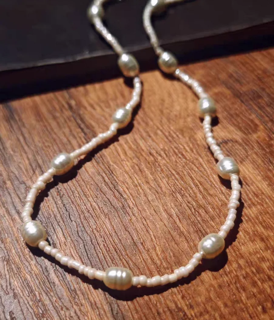 Baby's adem glazen parelketting