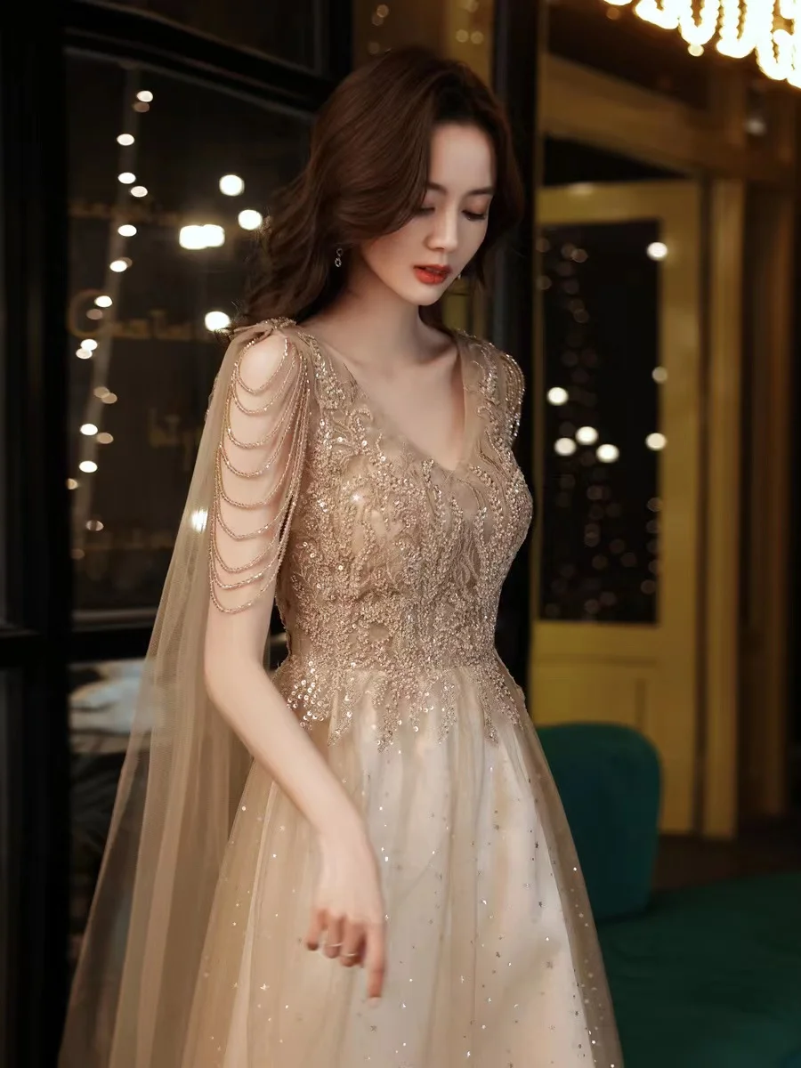 

New Sexy Champagne Gold Evening Dresses With Cape Elegant V-Neck Shiny Sequins Appliques Tulle Shawl Formal Celebrity Prom Gowns