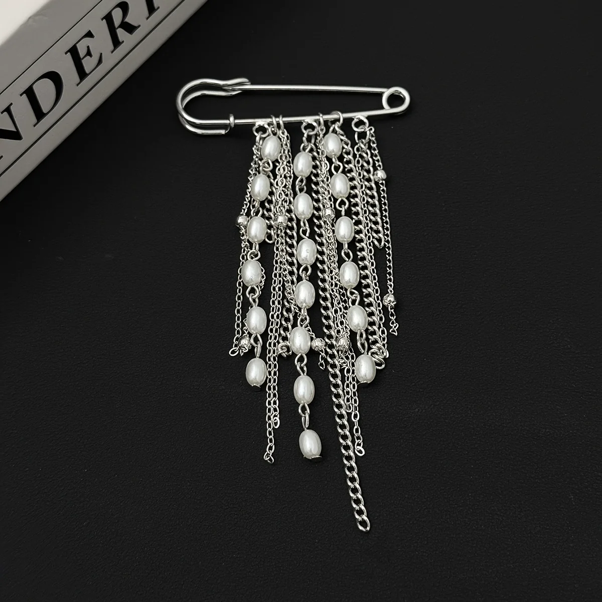 A unique punk-style brooch with chain tassels, stylish and cool, perfect as an everyday gift.