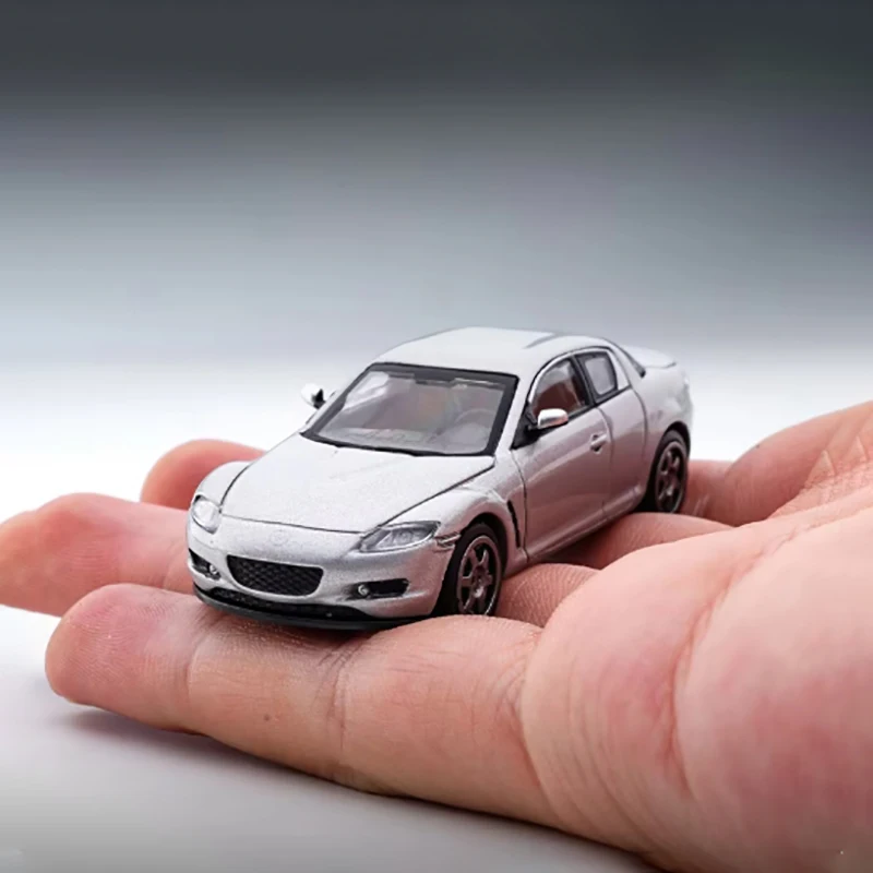 Modèle de voiture en alliage moulé sous pression Mazda RX-8 Simulation de voiture de sport Modèle de voiture à petite échelle Jouet l'inventaire Collection Décoration Cadeau Nouveau 1/64