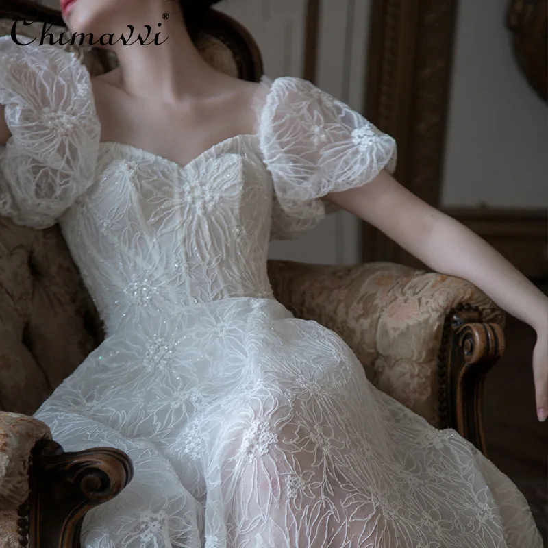 

2024 Spring and Summer New Fashion Lace Puff Sleeve Hollow-out White Dress Women's French High Waist Elegant Fairy Long Dress