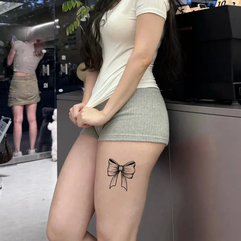 French Ribbon Bow Tattoo Sticker: herbal juice sensual design for neck scar cover. Vivid semi-permanent realistic art.