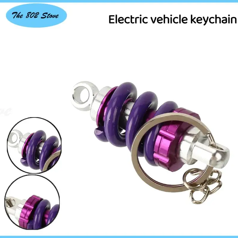 

Sleek Aluminum Alloy Shock Absorber Key Ring - Automotive Front Strut Pendant Compatible with Cars & Scooters