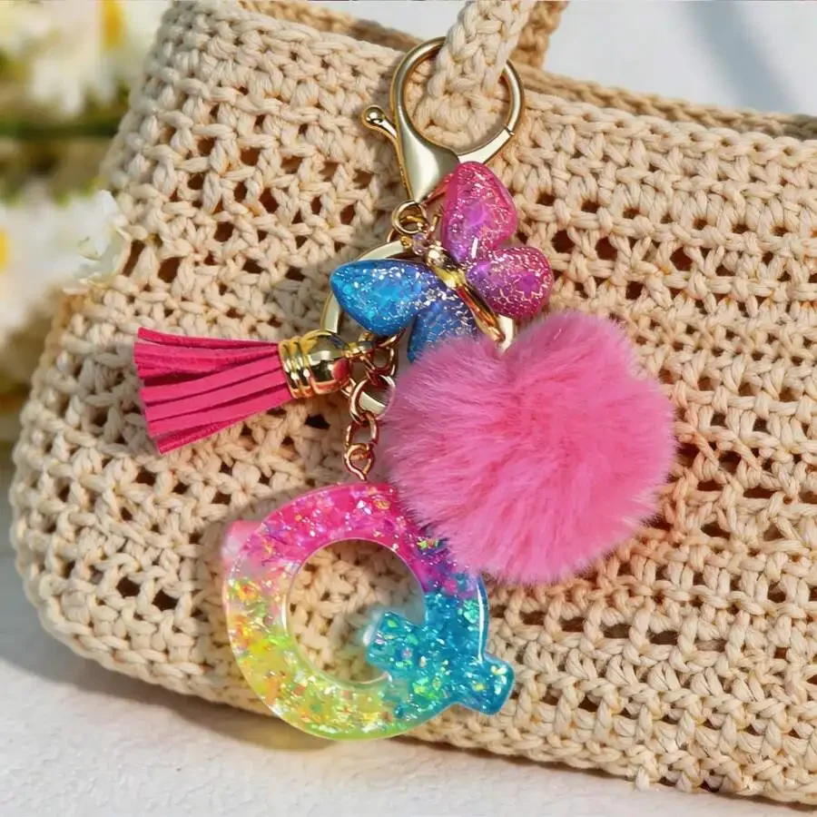 

Colorful Glitter Resin Alphabet Initial Keychain With Pink Pom Pom Tassel And Butterfly Charm For Women