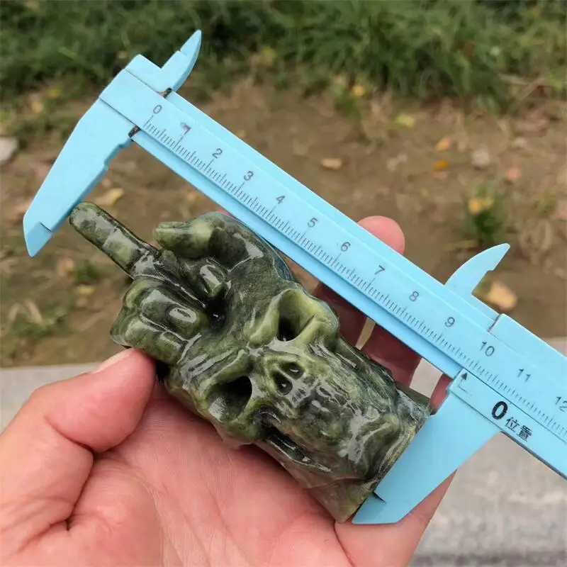 Natural Ophiolite Middle Finger Gesture Skull Carving Reiki Healing Feng Shui Home Decoration Stone Statues Gift 1PCS