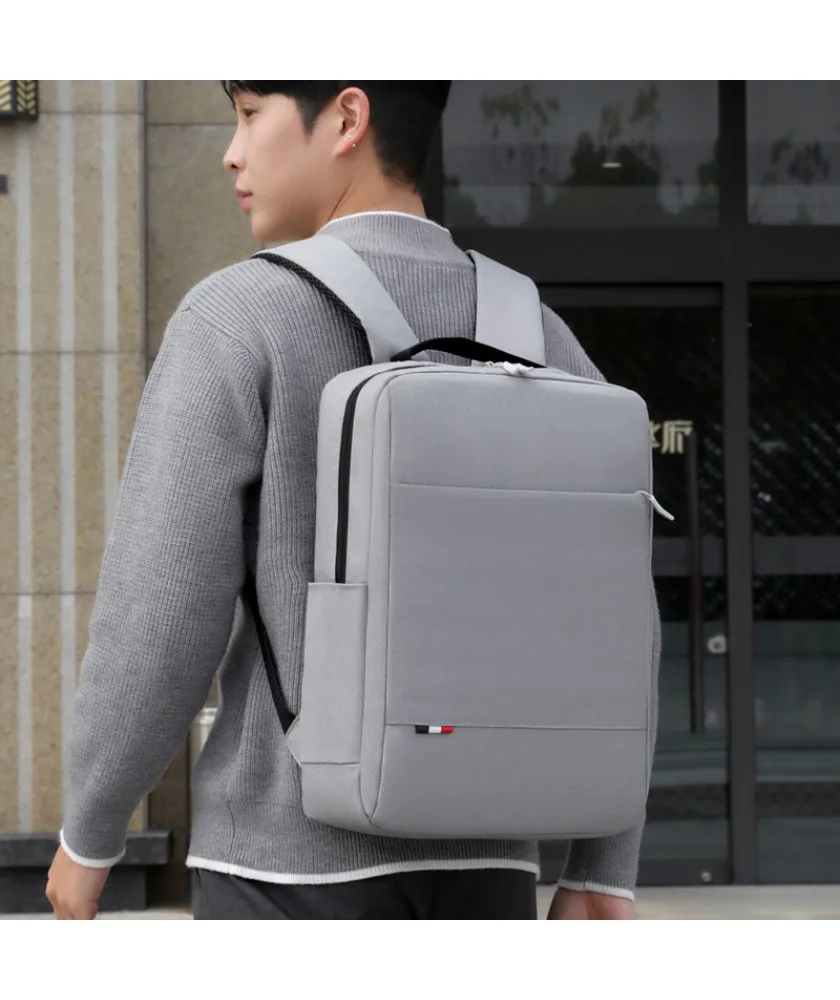 

Gray minimalist business laptop backpack slim design front slip pocket water resistant fabric suitable for office commute work
