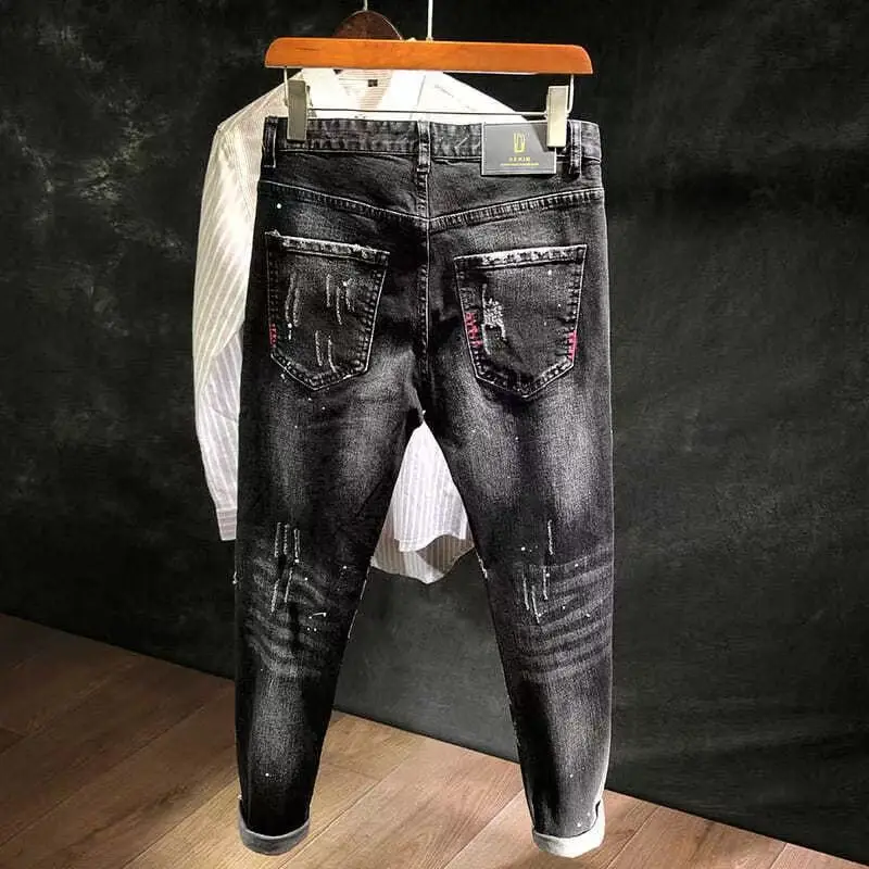 Baru 2023 musim gugur gaya Korea bekerja lubang robek hitam koboi Hip Hop Dotting tinta Jeans ramping pria celana Denim mewah untuk pria