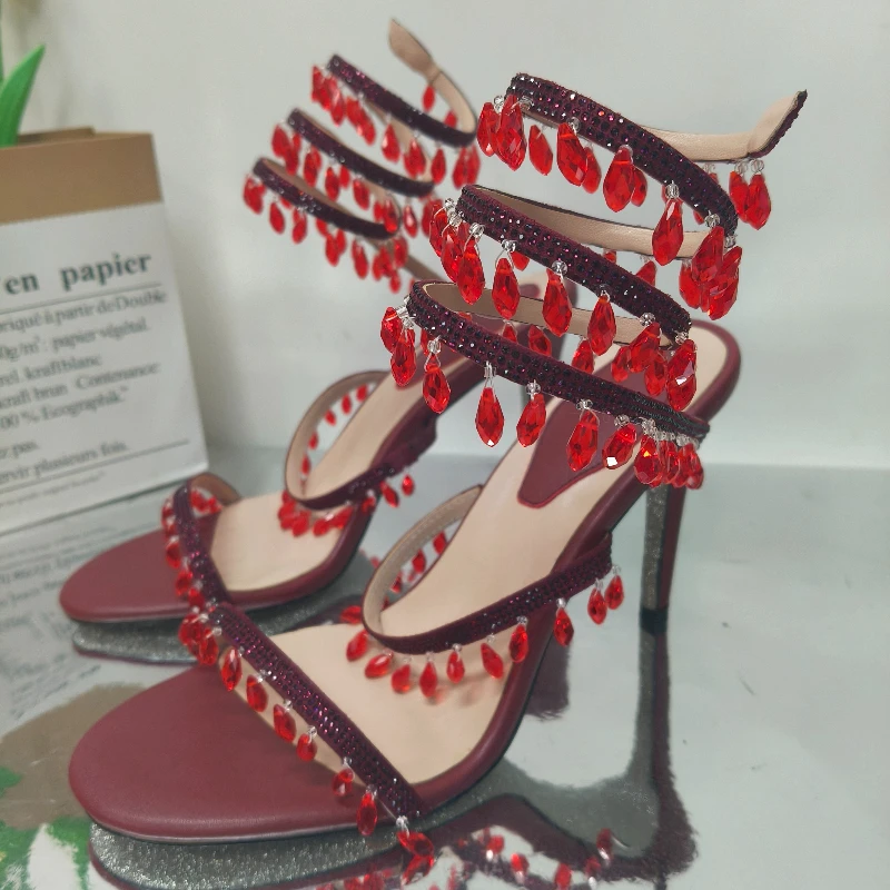 

Европейские и американские сексуальные ноги с бахромой в форме капли воды, обернутые ремни, тонкие босоножки на высоком каблуке, женские сценические прогулочные туфли