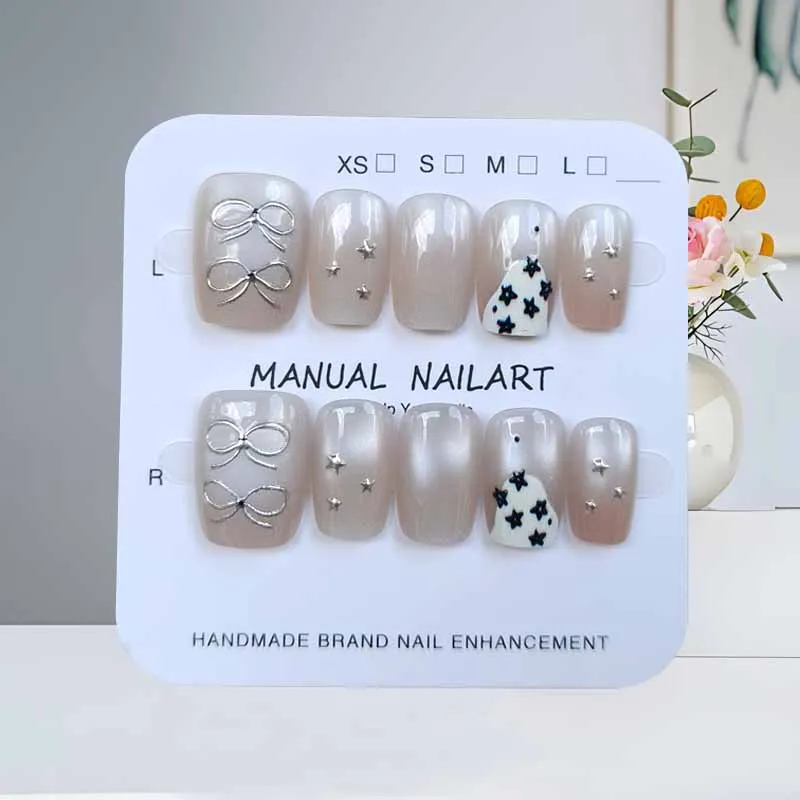 เล็บปลอมกดติดลายแมวตาสี่แฉกน่ารัก 10 ชิ้น สีขาวประดับทอง สวยหรู ระดับไฮเอนด์ สำหรับตกแต่งเล็บ