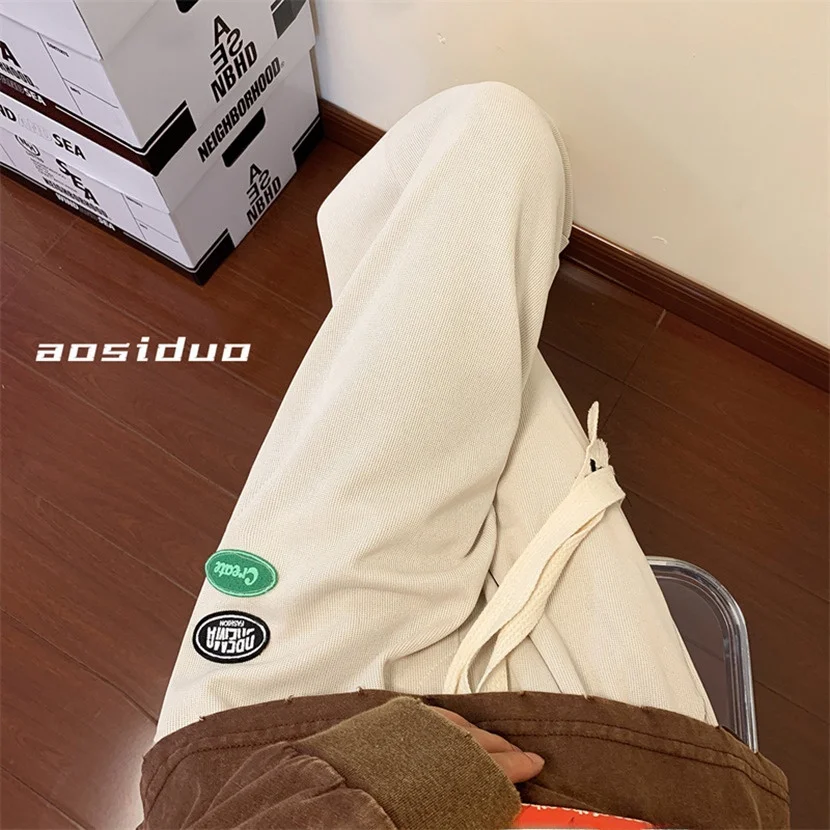 

Мужские свободные брюки с широкими штанинами, весенне-осенние, с завязками на манжетах, спортивные повседневные брюки, молодежные длинные прямые брюки-трубы