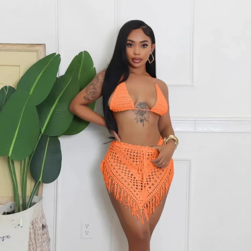 

2025 Summer Hand Crochet Knitted 2 Piece Set Women Solid Lace Up Halter Bra + Tassel Irregular Mini Skirts Vacation Beach Suits