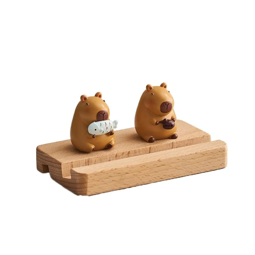 

Фигурка Модель Капибара Держатель для телефона Поддержка ПВХ Кукла Капибара Подставка для мобильного телефона Мультяшная деревянная капибара Кронштейн для мобильного телефона