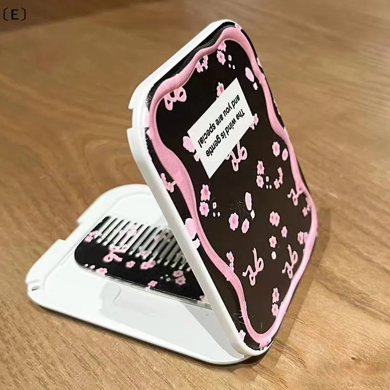 〔E〕Espejo de maquillaje plegable con diseño de lazo rosa, espejo de bolsillo portátil para mujer, espejo cosmético rectangular con peine