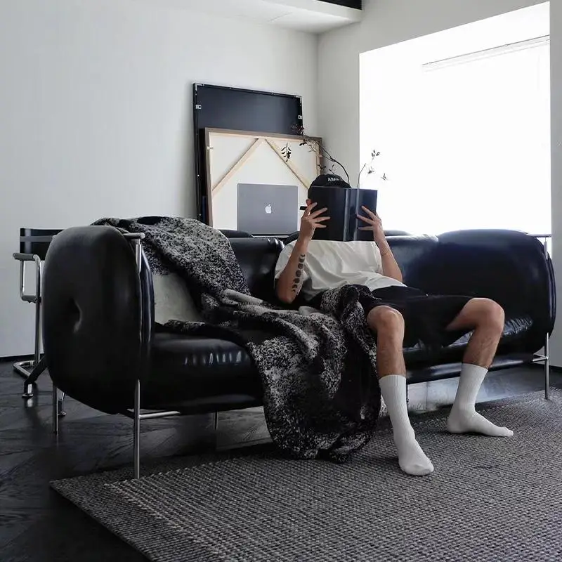 

Black leather sofa three-person stainless steel Bauhaus medieval sofa light luxury small apartment clothing store