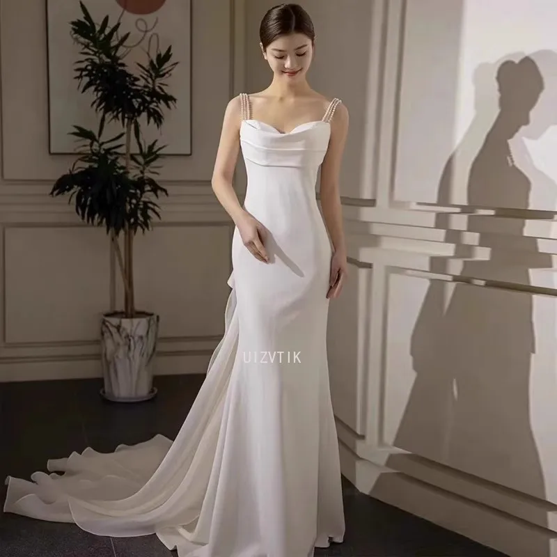 Seksowne suknie ślubne z koralikami Backless kobiety biały satynowy pasek Spaghetti zdjęcia strzelać sukienka Fishtail wstążka ogon suknie ślubne