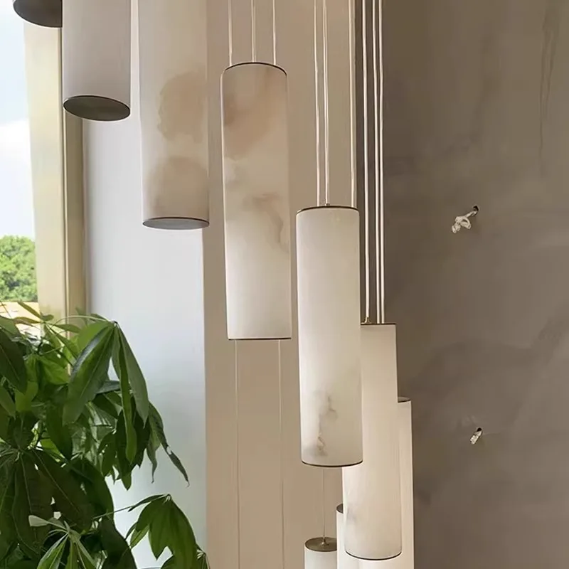 Luxury modern gold cylindrical pendant light featuring natural marble for staircase indoor ceiling decorative LED lighting