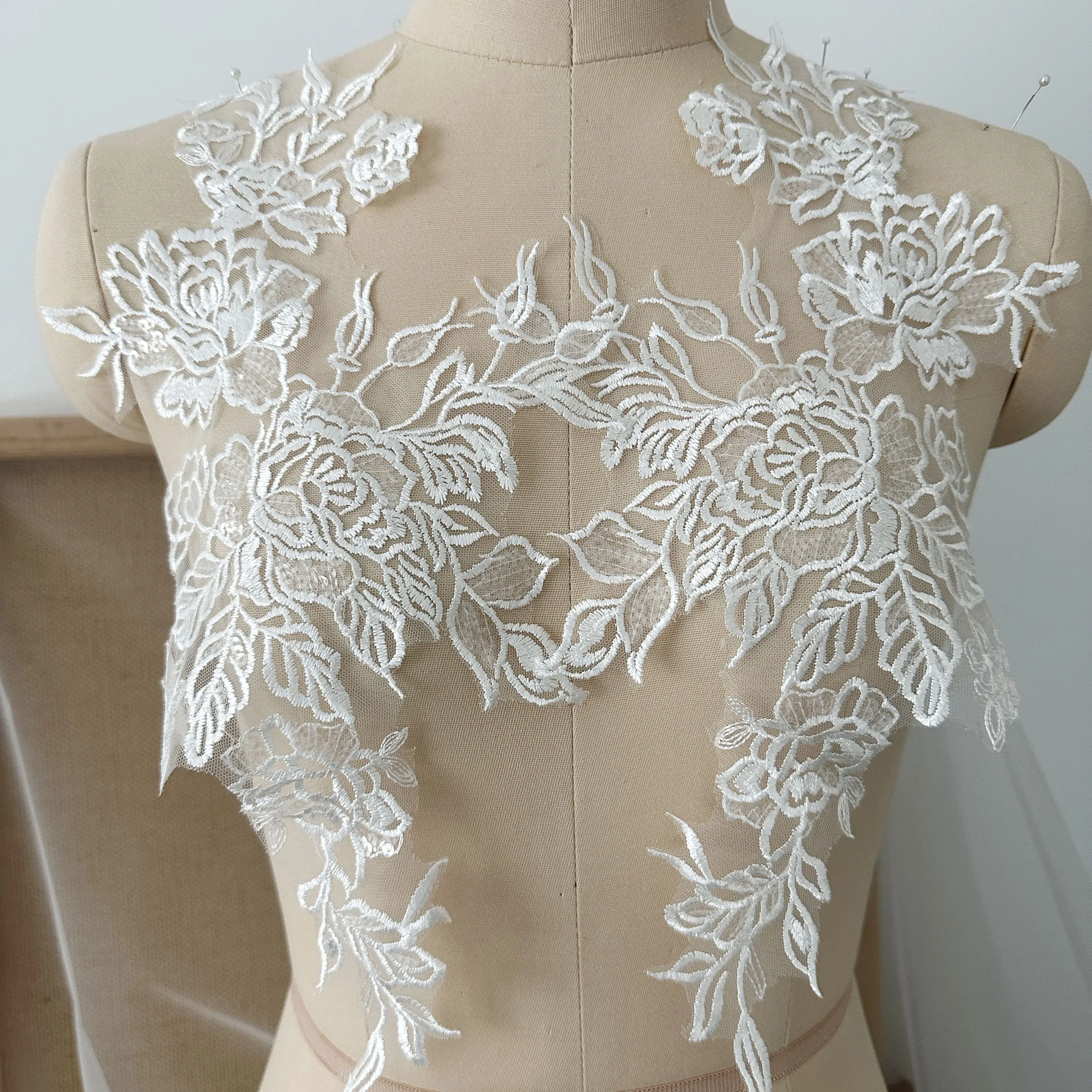 

A pair of exquisite sequined lace paired with floral mesh embroidery lace floral veil