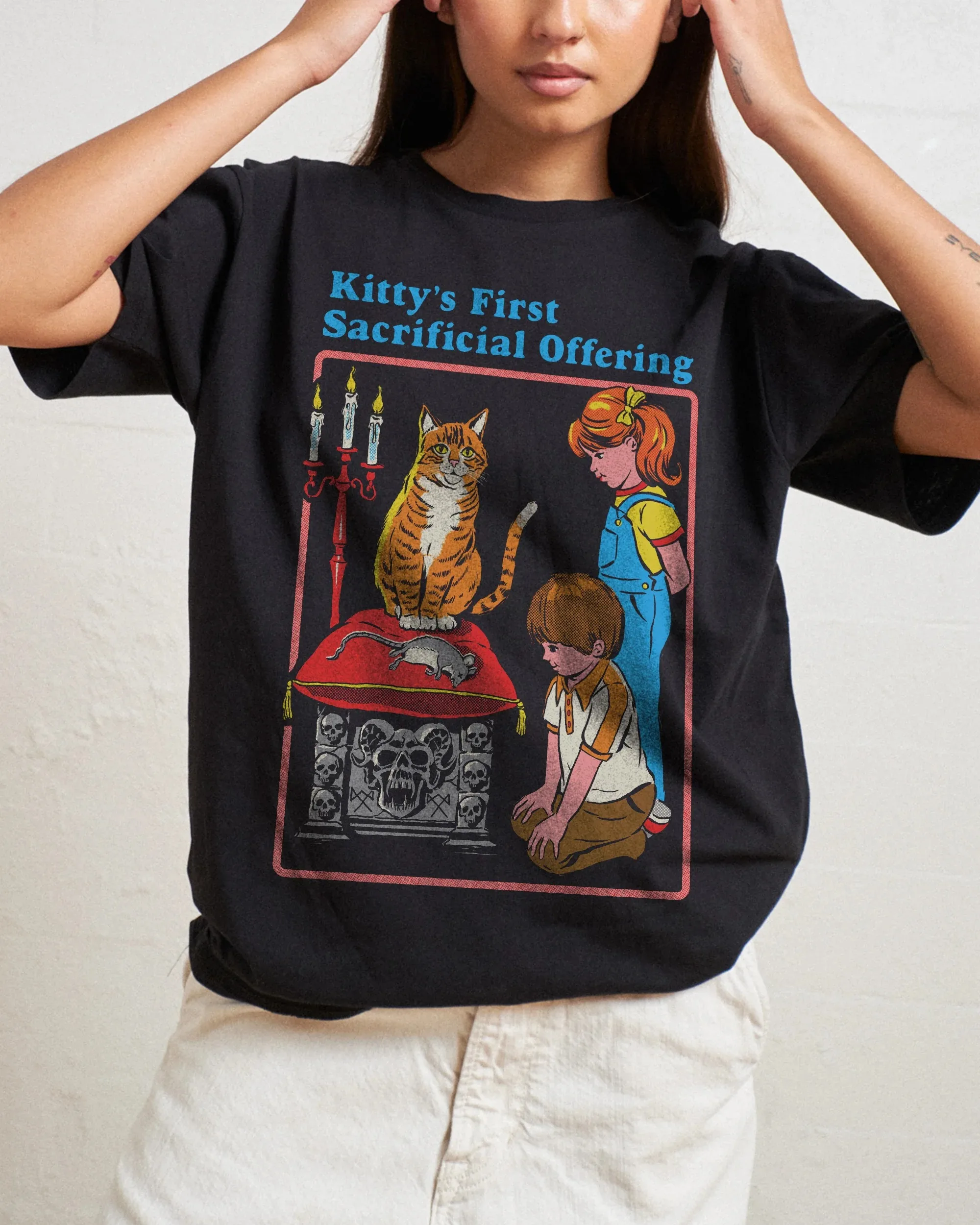 

Dark Humor Kitty's First Sacrificial Offering Cotton Tee Cat Graphic for Trendy Outfits and Spooky-Halloween Tee All Saints' Day