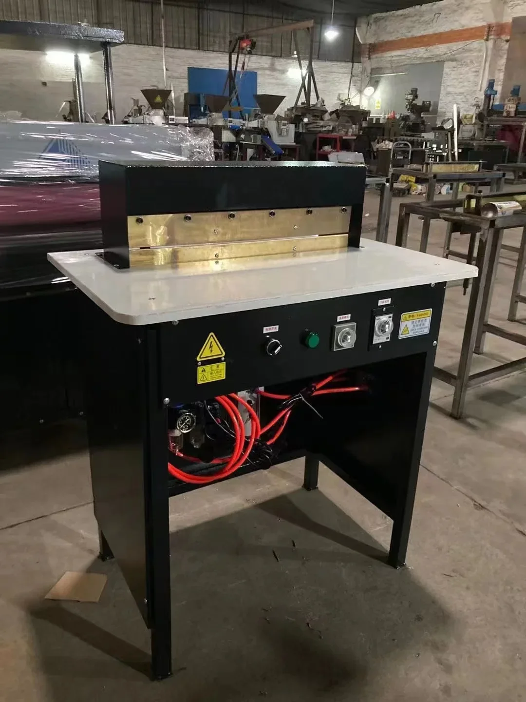 

Pneumatic hardcover book slotting machine